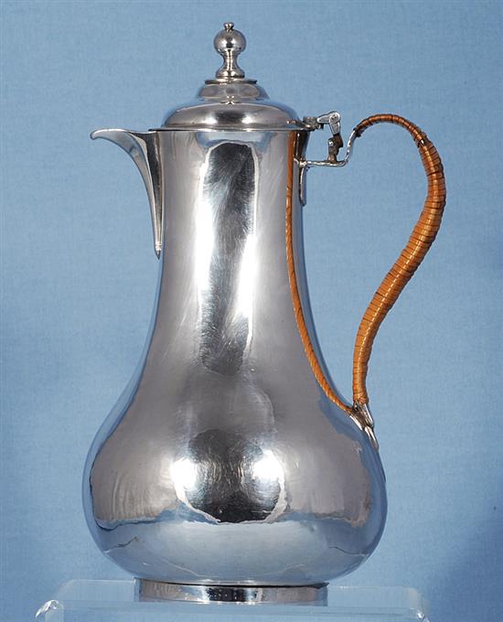 An Irish George III silver hot water pot, maker probably William Thompson, Height: 239mm gross weight: 14.7oz/460grms